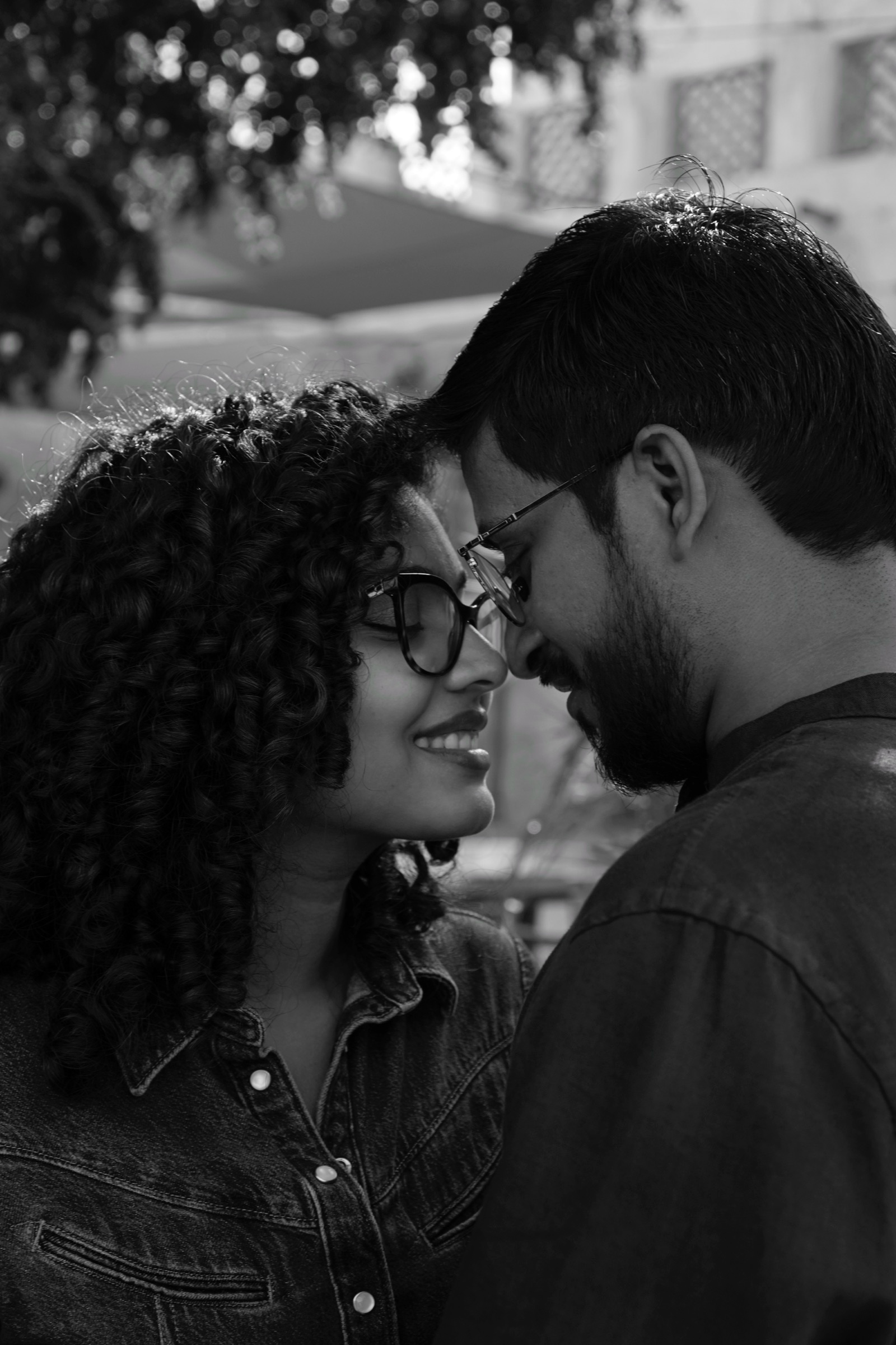 Couple resting foreheads together, black and white