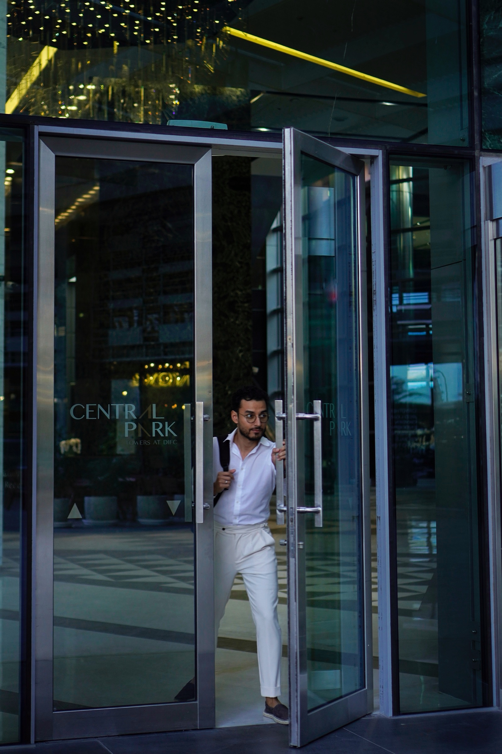 Businessman entering a glass office building
