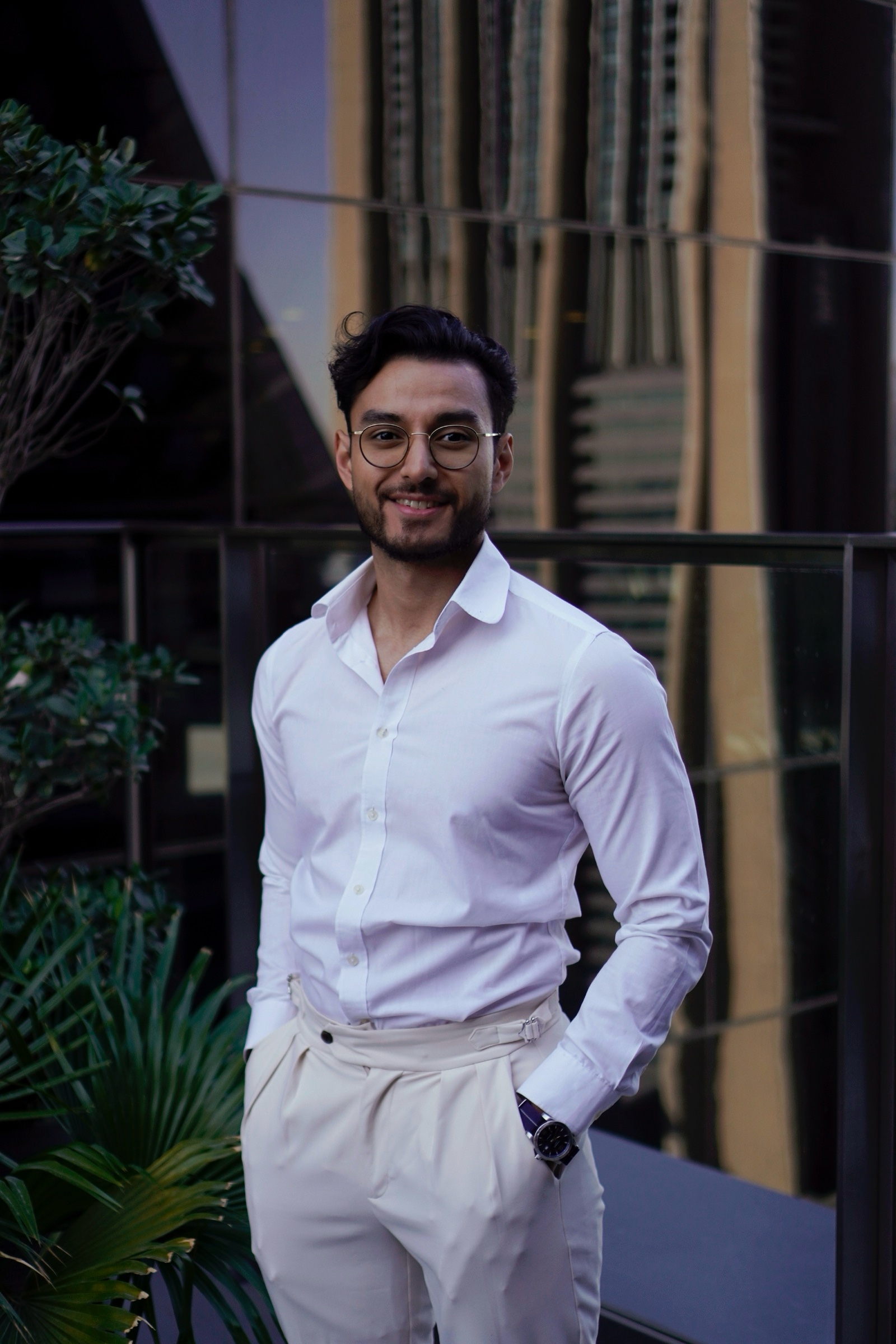 Smiling businessman portrait by the window