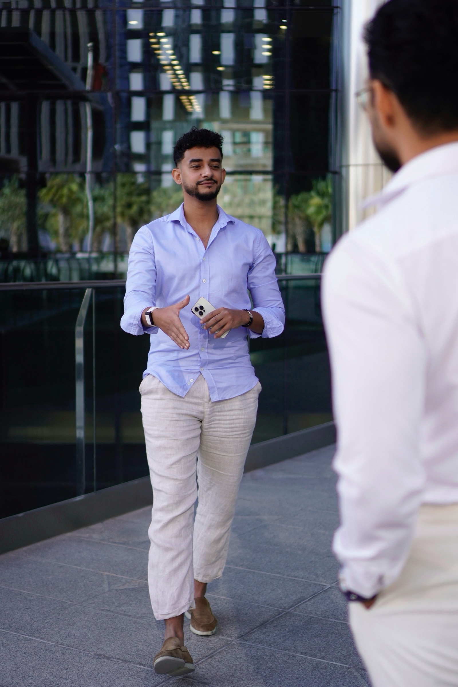 Businessman walking through a tower plaza