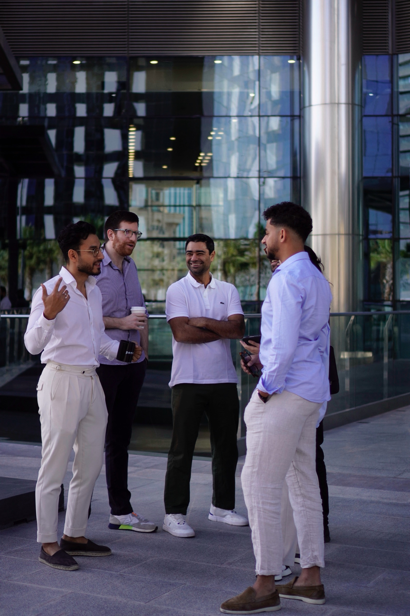Team chatting in an outdoor office plaza