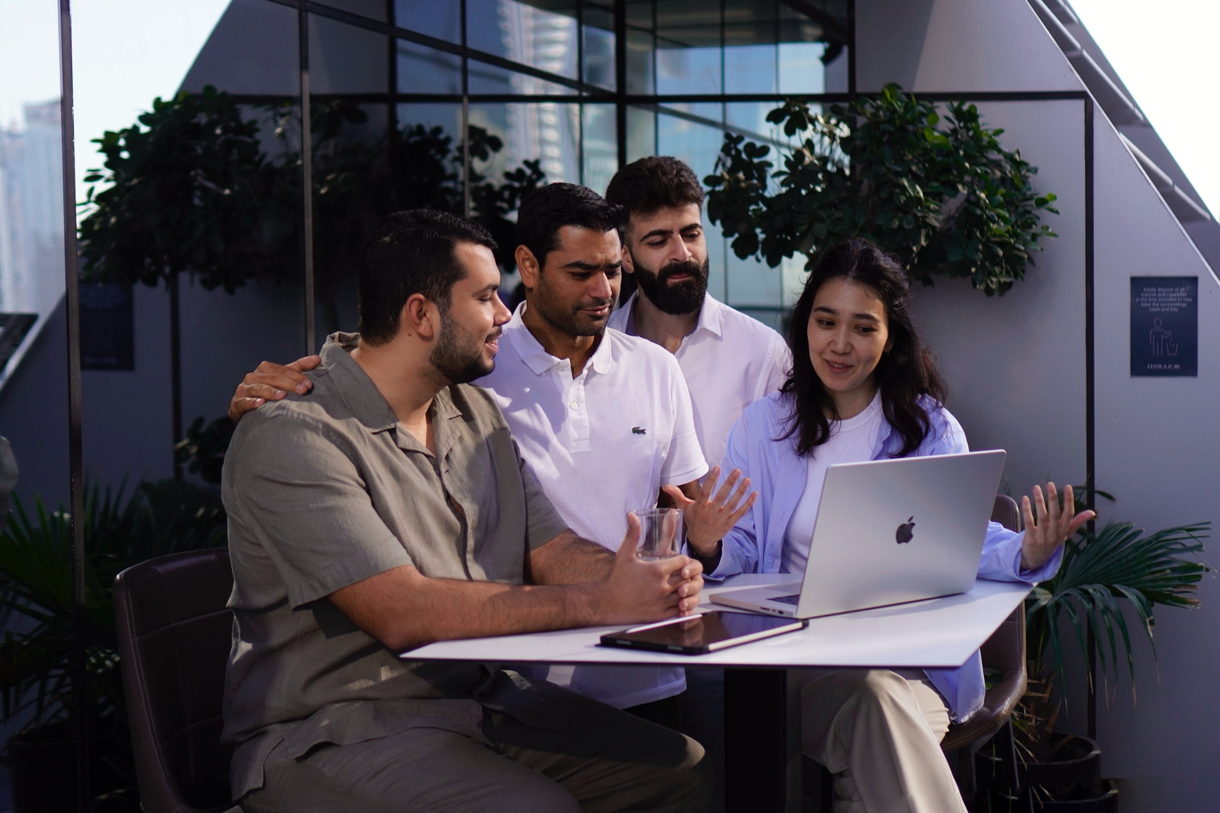 Team collaborating over a laptop