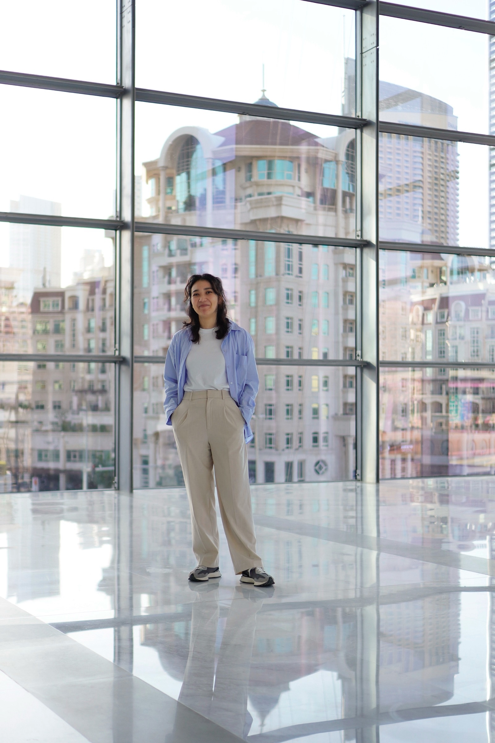 Businesswoman portrait by a skyline window