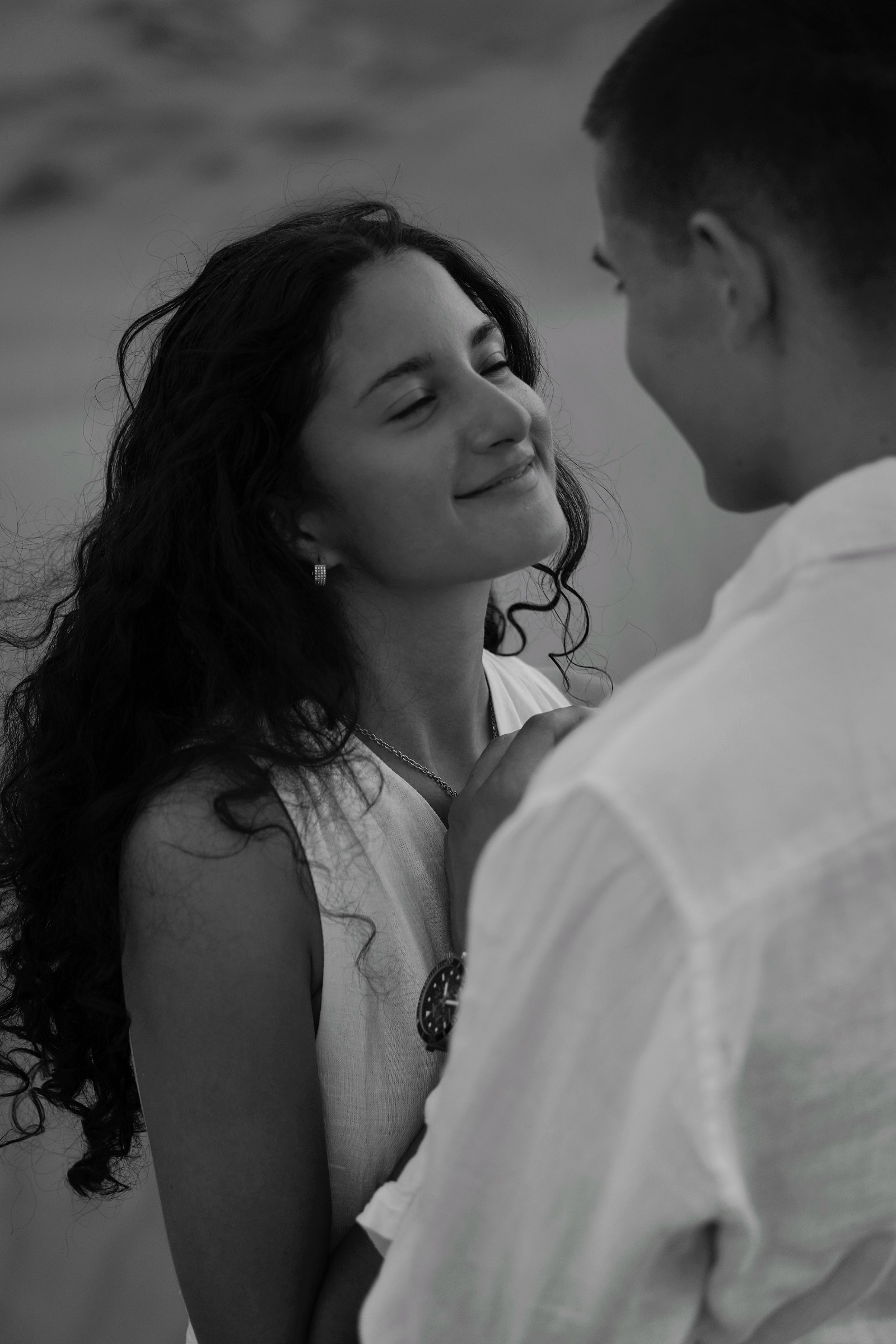 Couple with faces close together, black and white