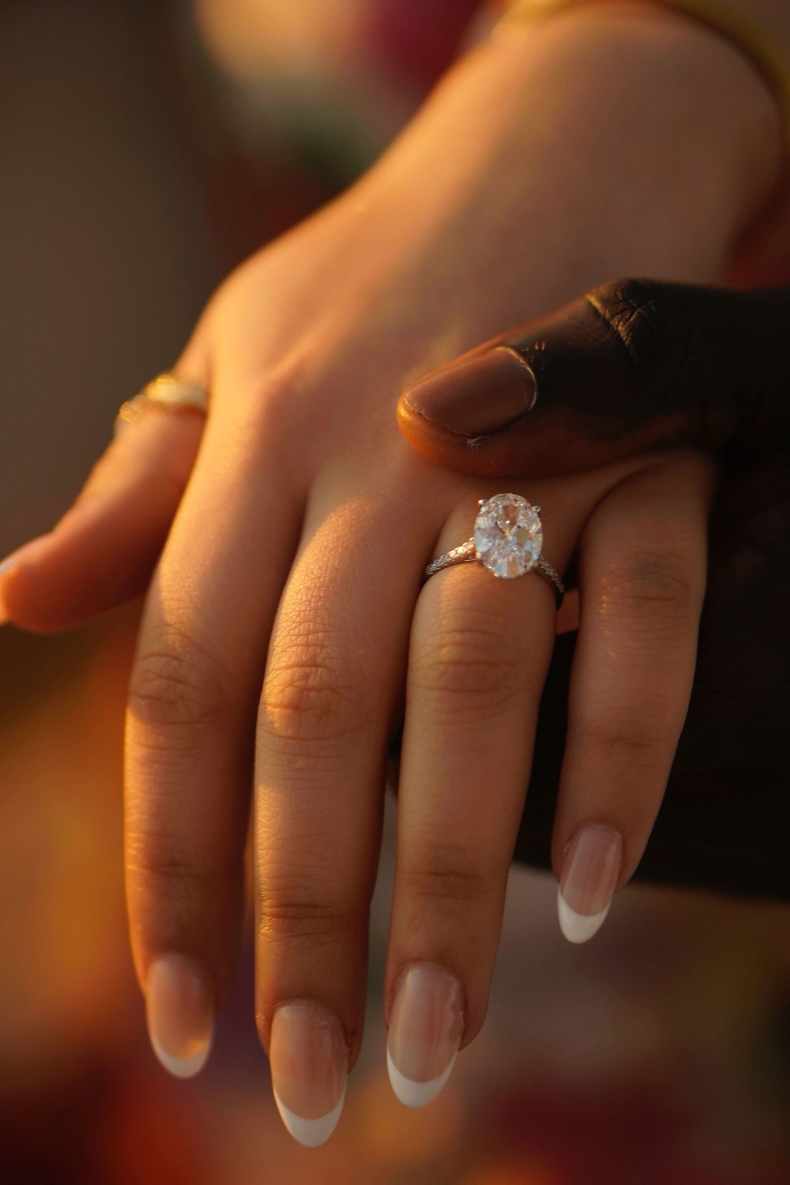 Close-up of an engagement ring on her hand