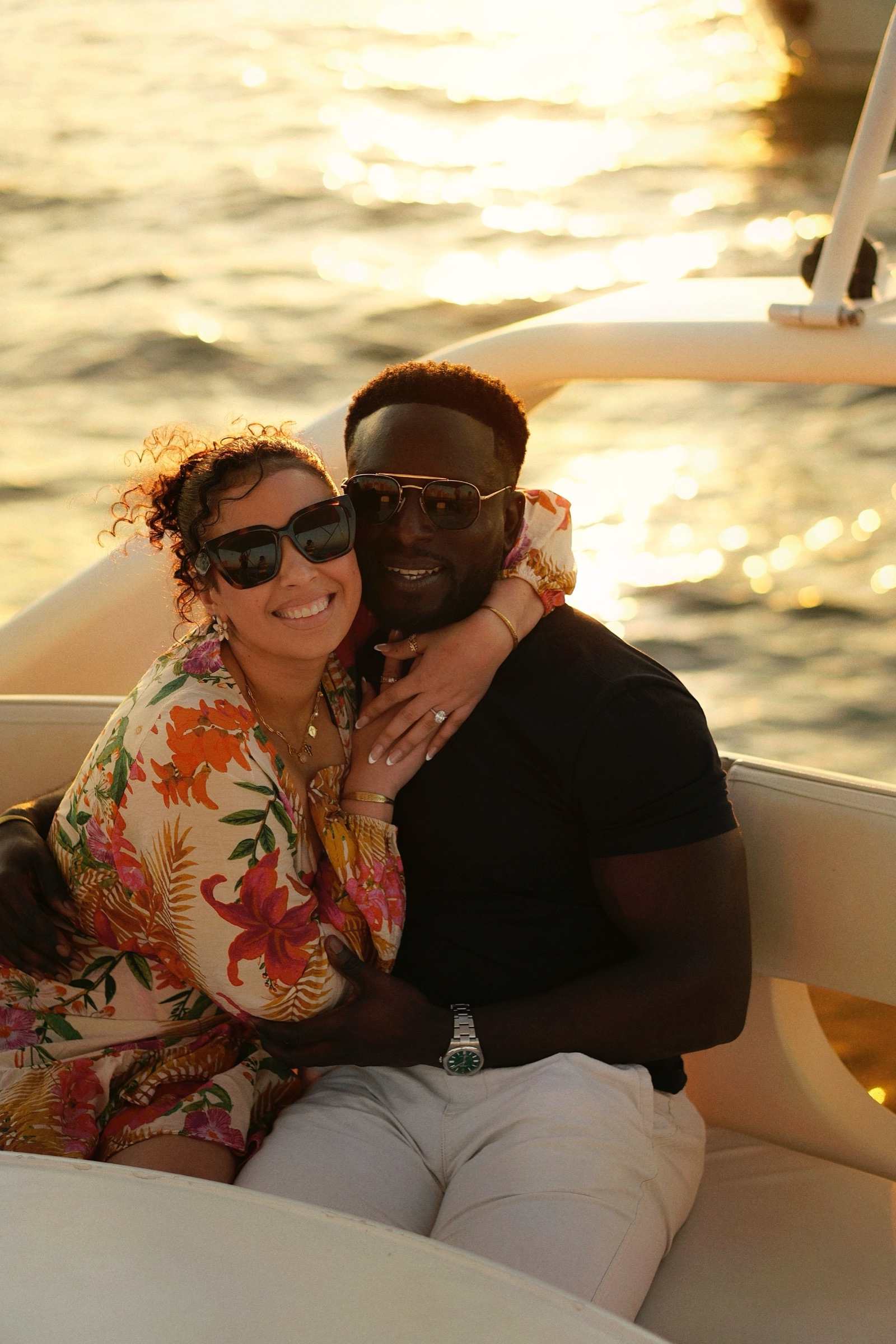 Couple embracing at golden hour on a yacht