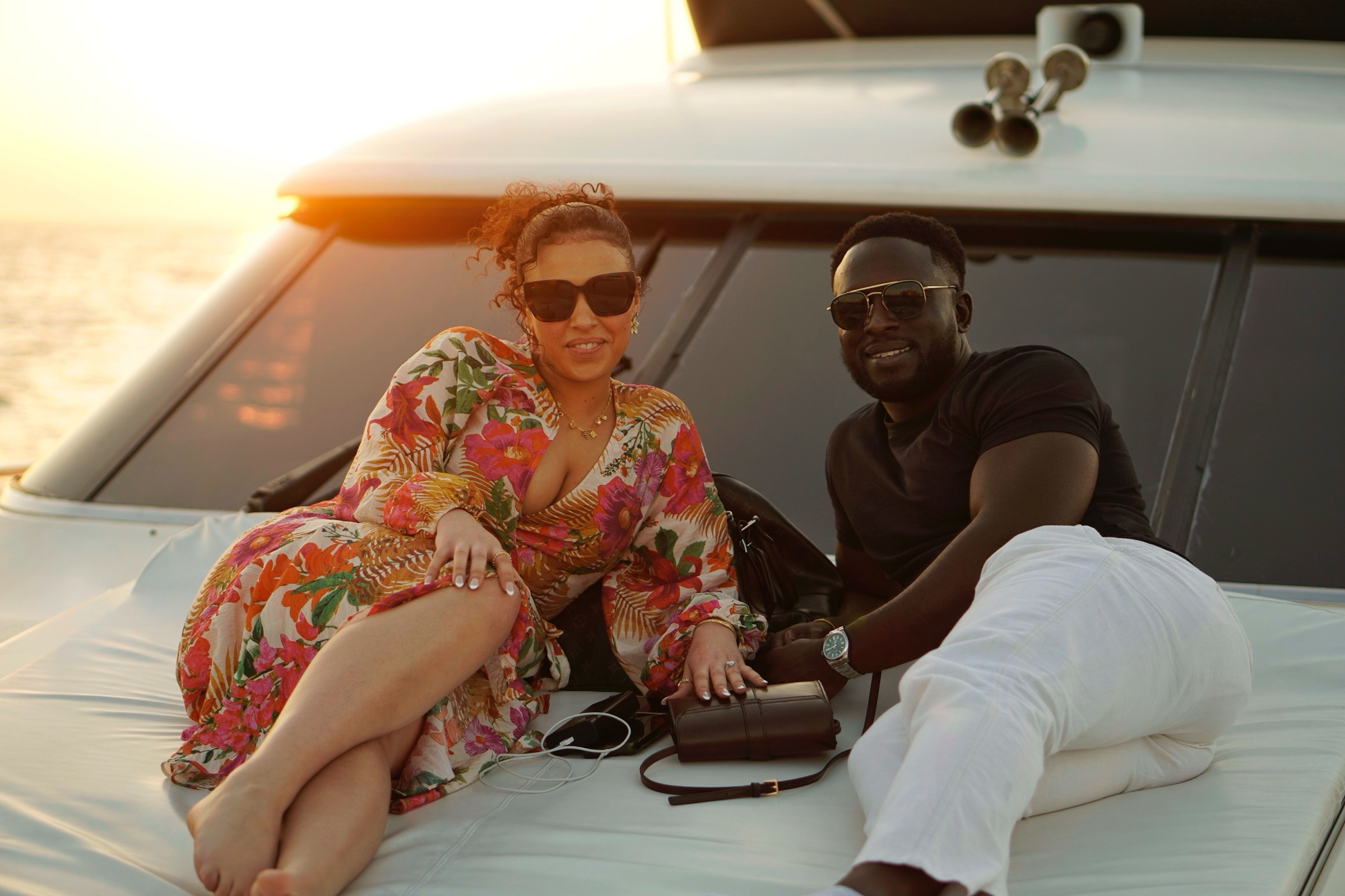 Couple reclining together on a yacht deck