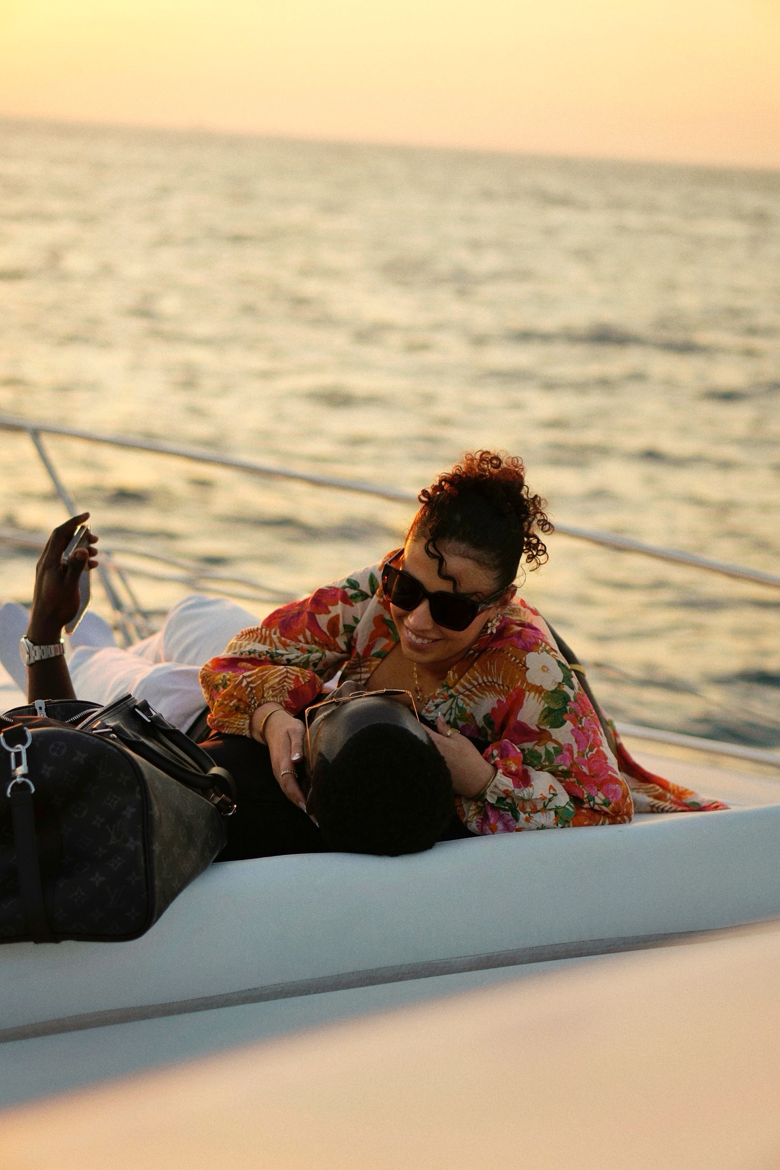 Couple reclining and embracing on the deck