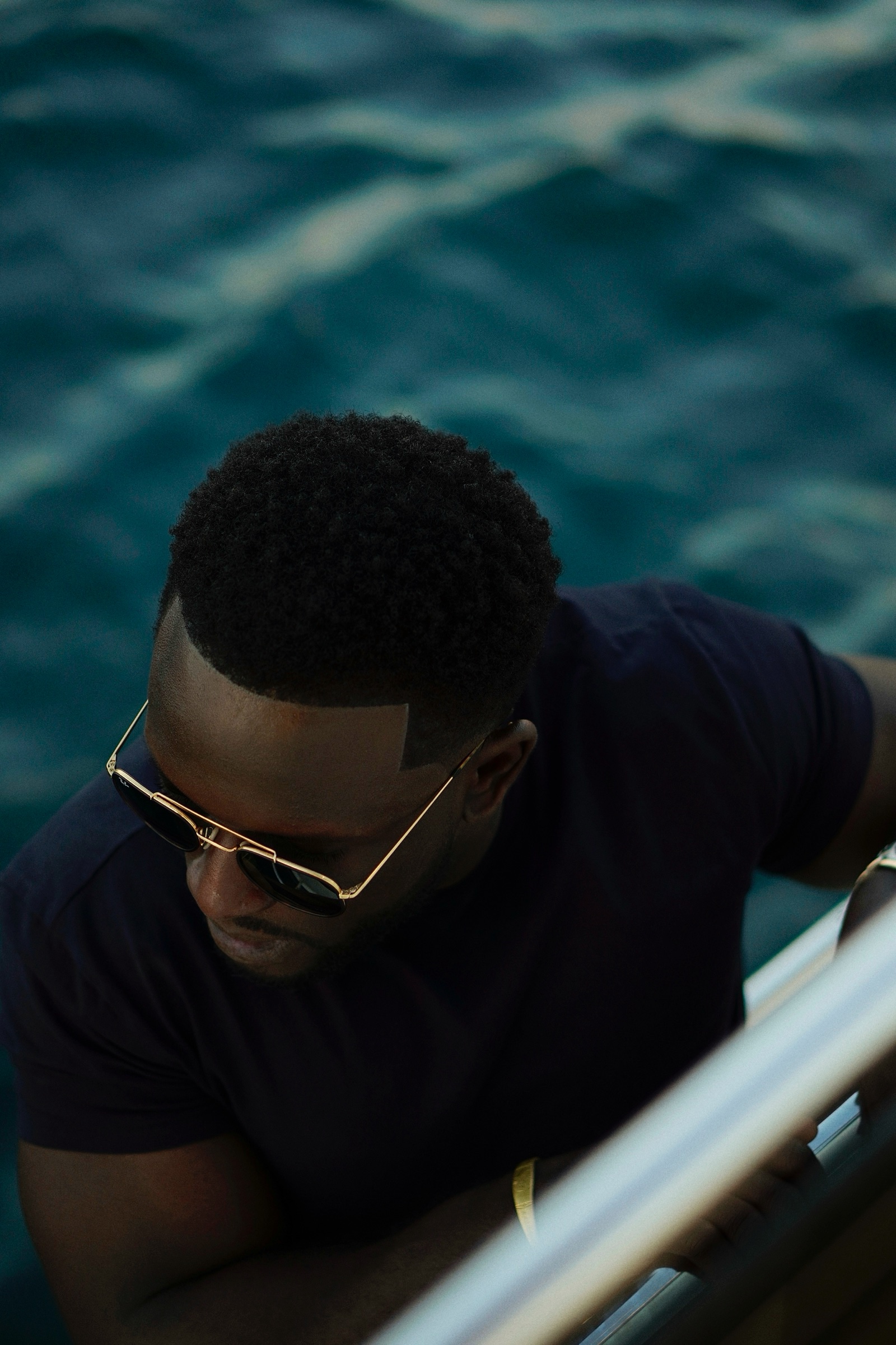 Portrait of a man in sunglasses on a yacht