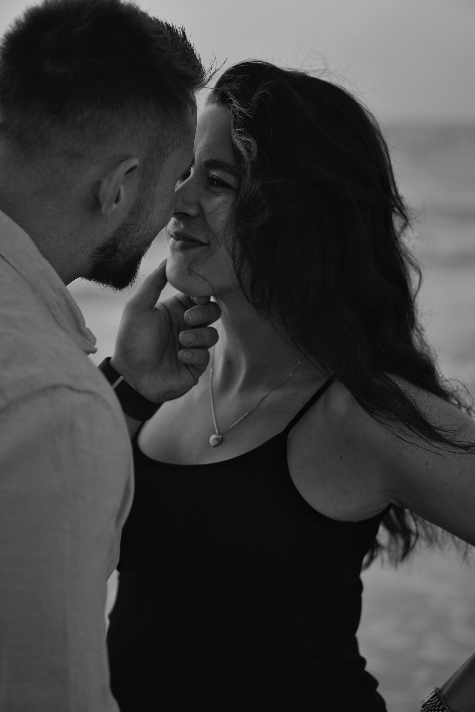 Couple sharing a tender moment, black and white