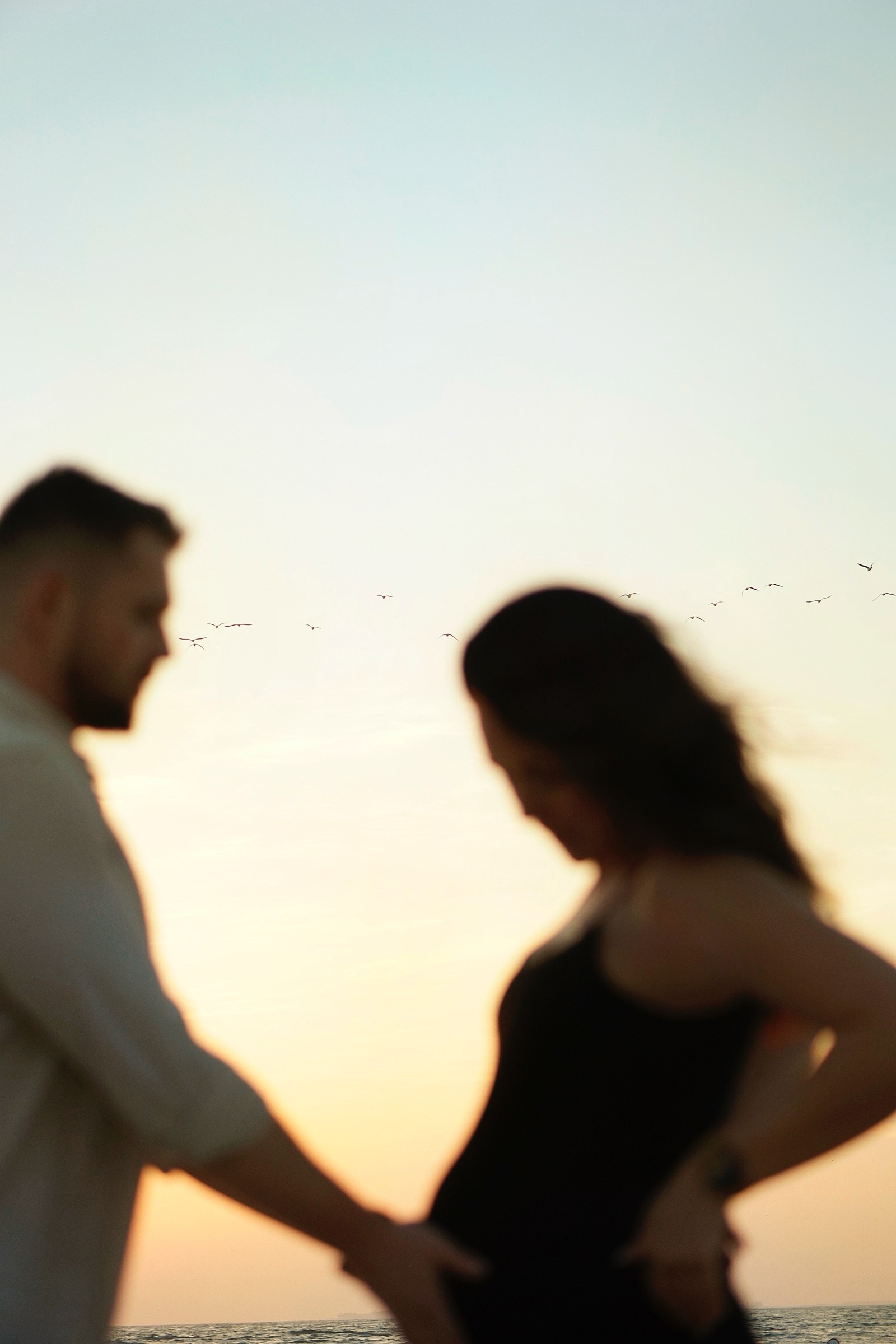 Couple silhouette cradling the bump