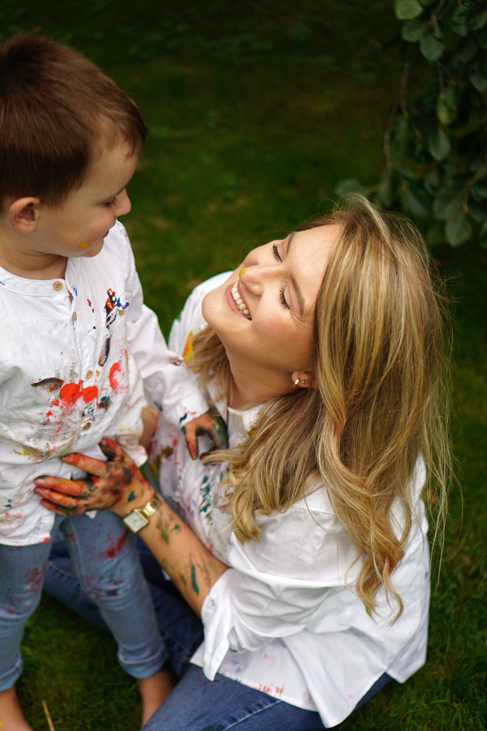 Mother and laughing son on the grass