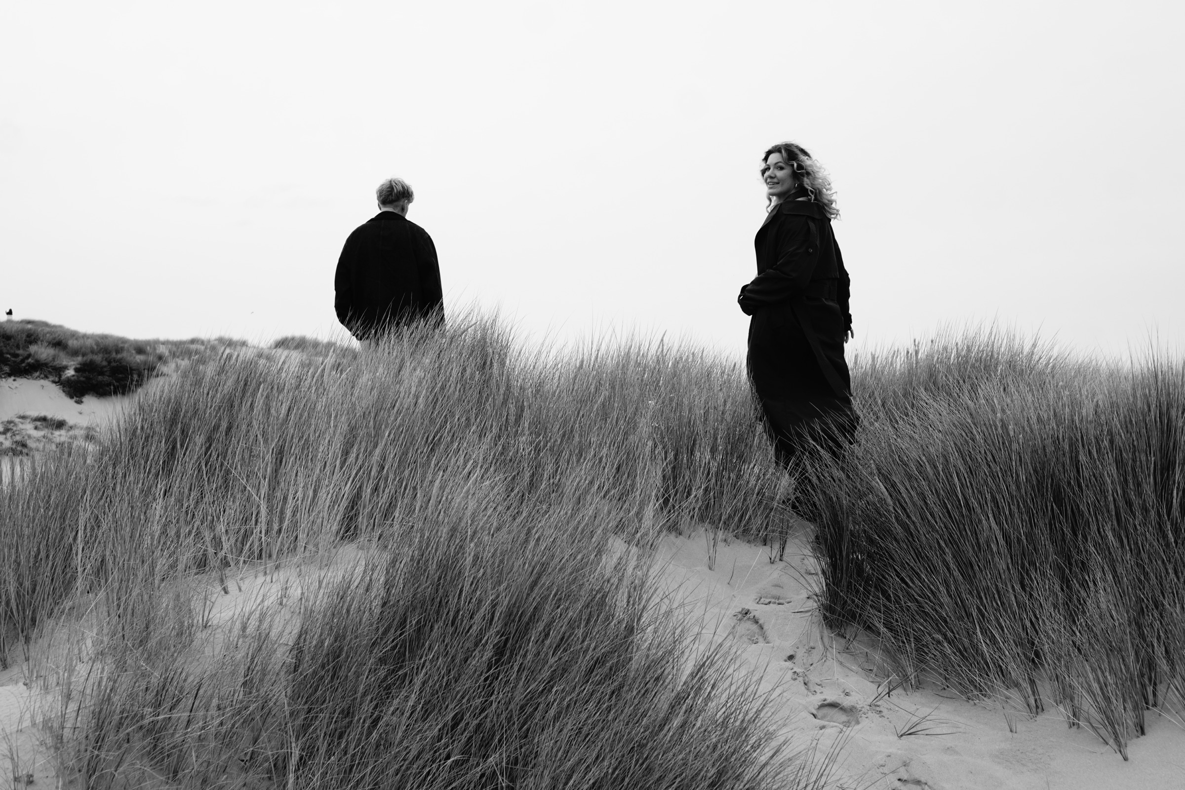 Couple embracing on moody coast